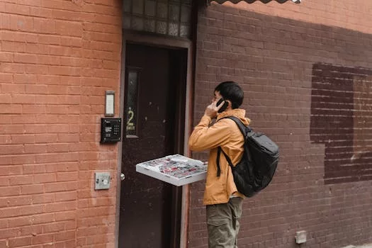 delivery driver with pizza boxes